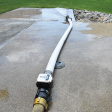 AkroFlow Portable Flow Meter connected to fire hose